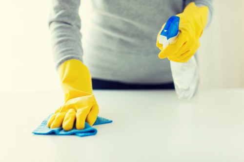 Carpet cleaner preparing equipment safely before a cleaning job