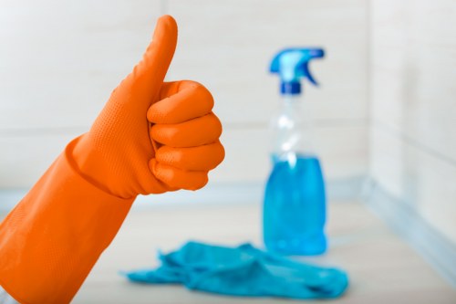 Technician using protective equipment while applying carpet cleaning products