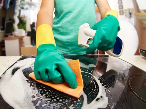 Upholstery cleaning process on a cushioned armchair